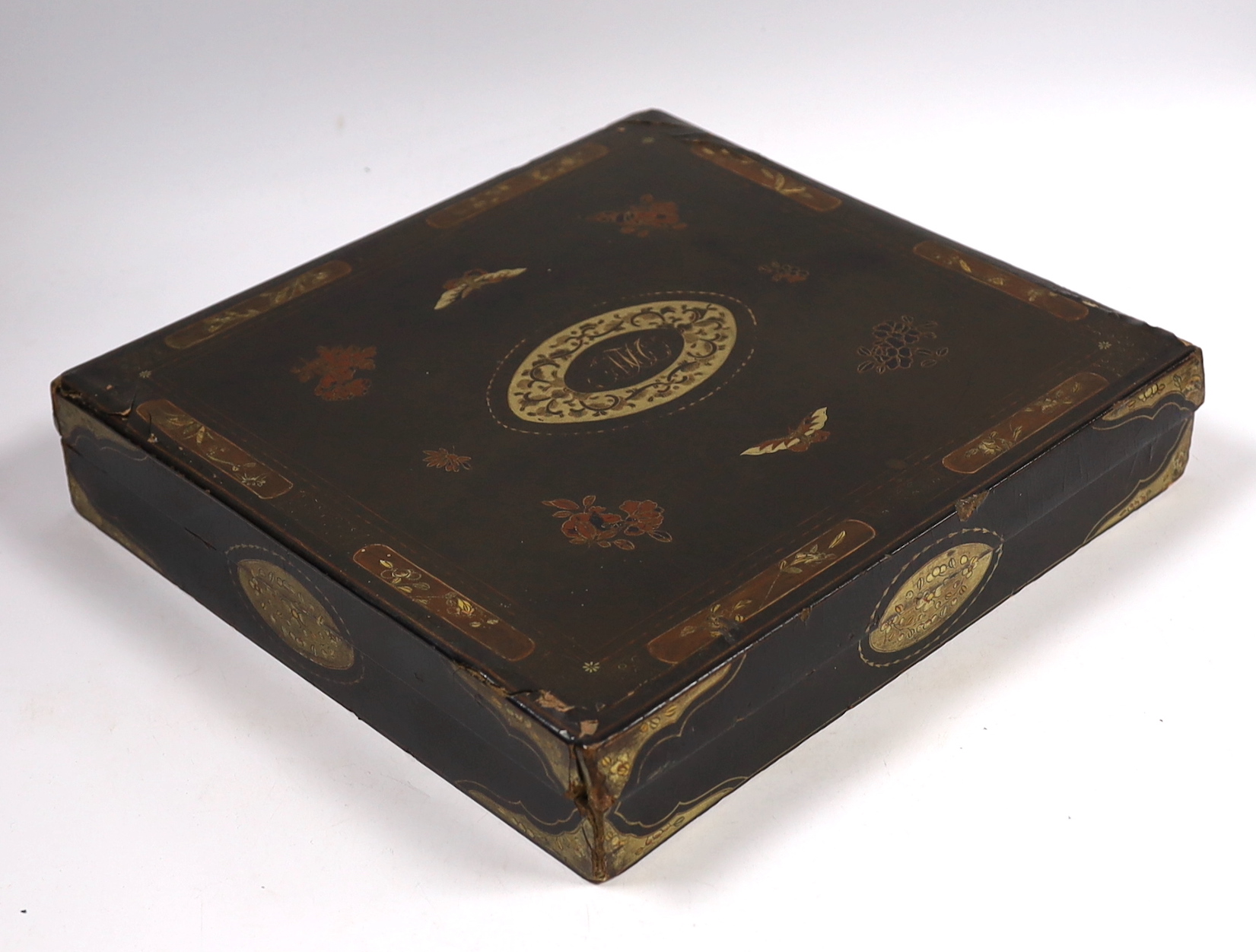 A mid 19th century Chinese export lacquer games box, containing mother of pearl counters